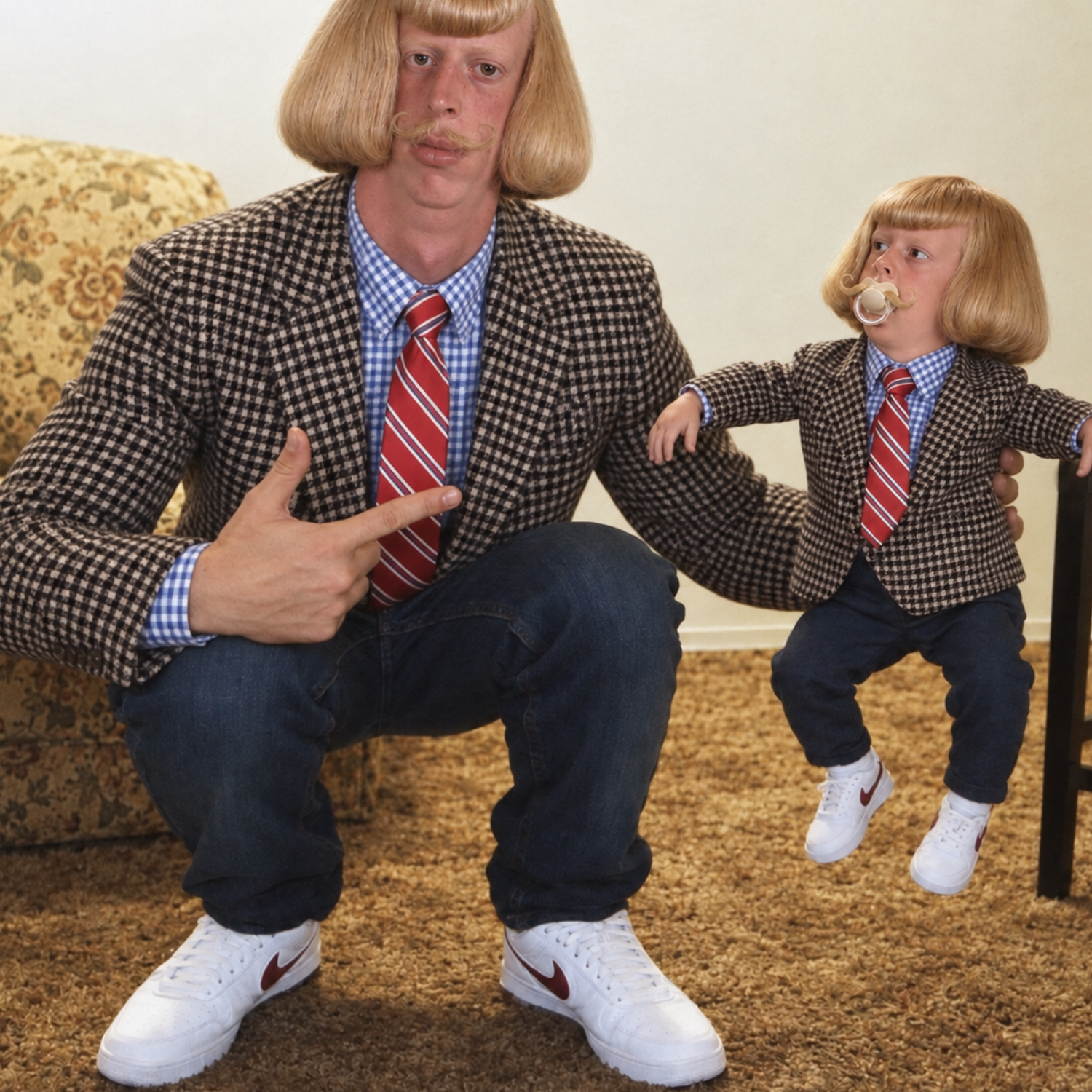 BabyJean and his grown-up look-alike in matching checkered blazers